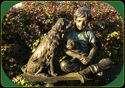 Statue of a boy and his dogs